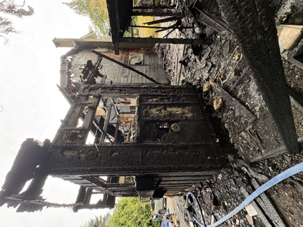 Damage from the French Road South residential structure fire on May 24, 2026. Sooke Fire Rescue, with support from mutual aid partners, contained the fire. Three occupants safely evacuated, no injuries were reported, and a family of four was displaced. The cause remains under investigation.